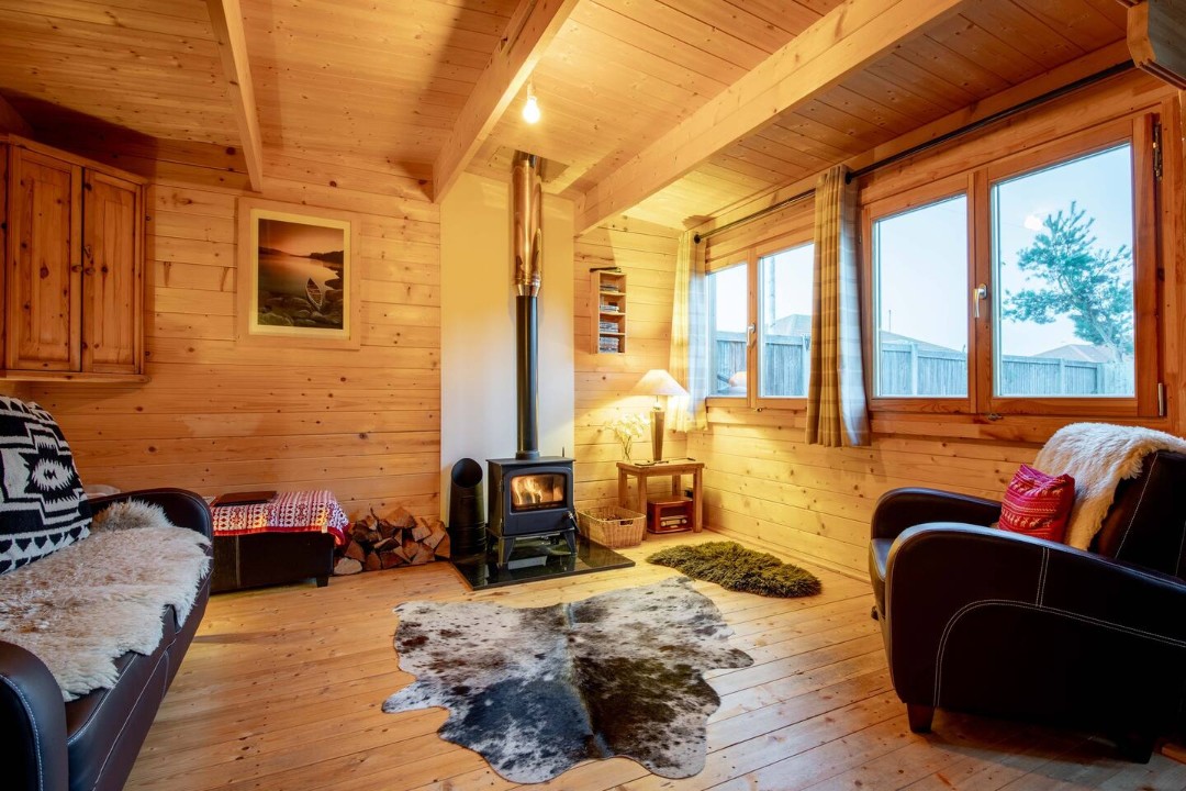 Living area with wood burner - The Spa Cabin