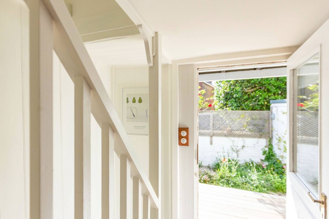 doorway form kitchen leads to court yeard garden -Boatswains Cottage
