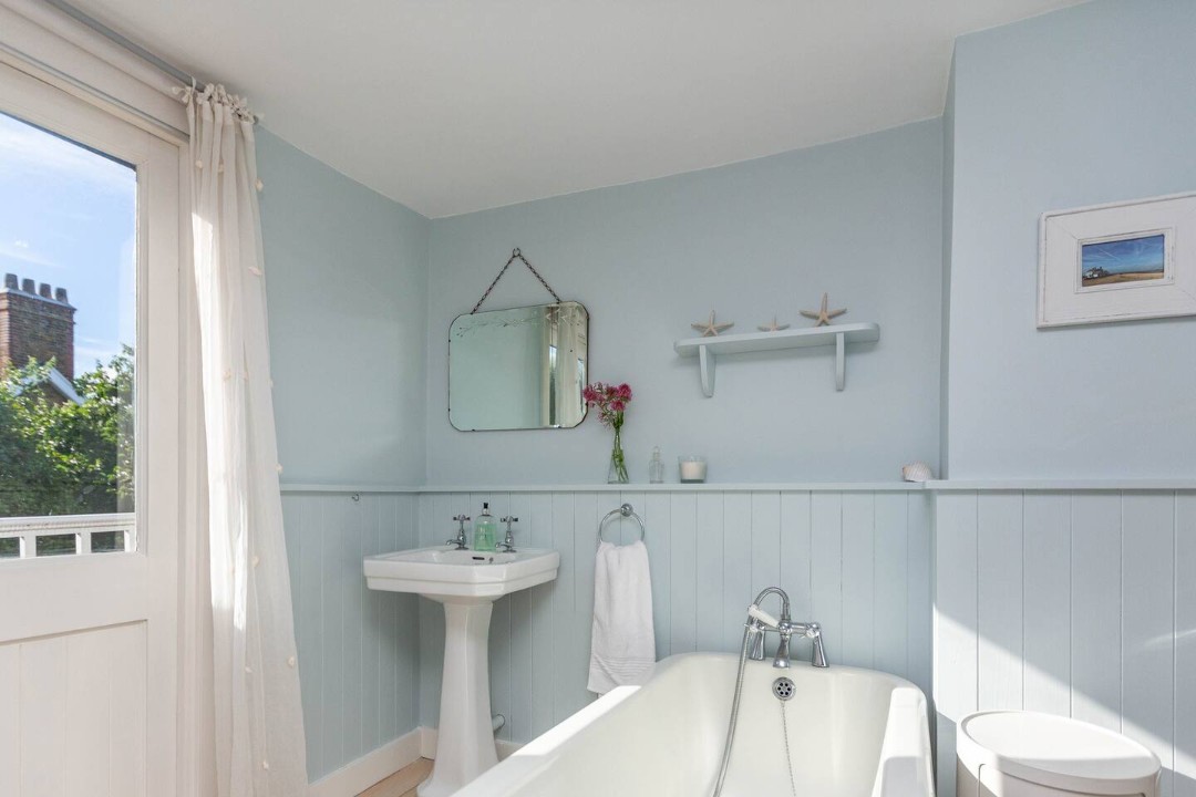 first floor bathroo with handheld shoer, sink and wc - Boatswains Cottage
