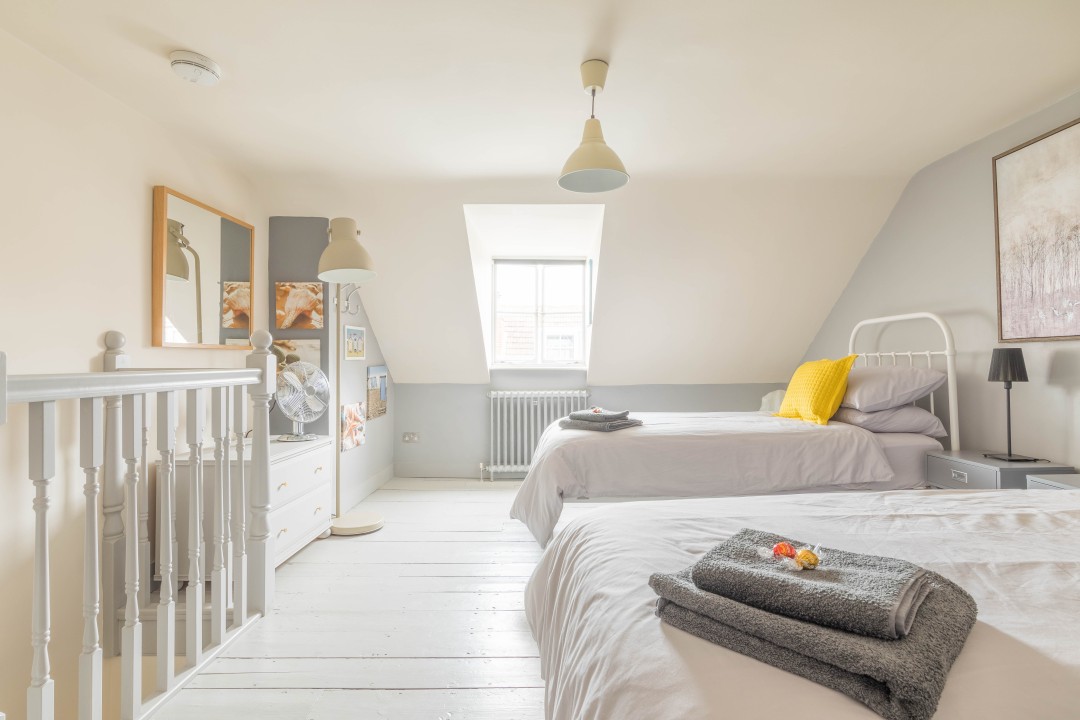 front facing attic room with twin beds - White Cottage