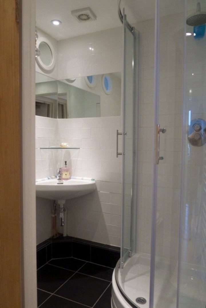 Flat One Harbour Street bathroom with walkin shower, wc and basin