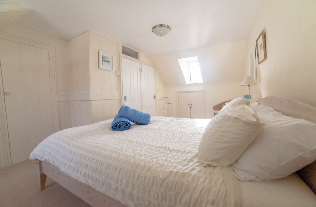 king size attic room with en-suite toilet and basin